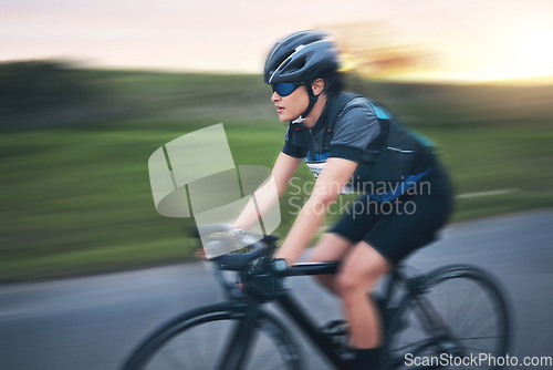 Image of Motion blur, fitness and cycling woman on road for training, competition and nature championship. Workout, sports and triathlon with female cyclist on bike for freedom, exercise and fast speed