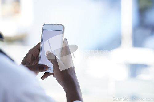 Image of Doctor, man and hands with phone mockup for telehealth, healthcare or life insurance at hospital. Hand of male medical professional holding smartphone and copy space display for advertising at clinic