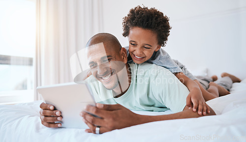 Image of Happy father, child and watching on tablet in bed for fun streaming or entertainment together at home. Dad, son or kid with smile relaxing with technology for movie, series or education in bedroom
