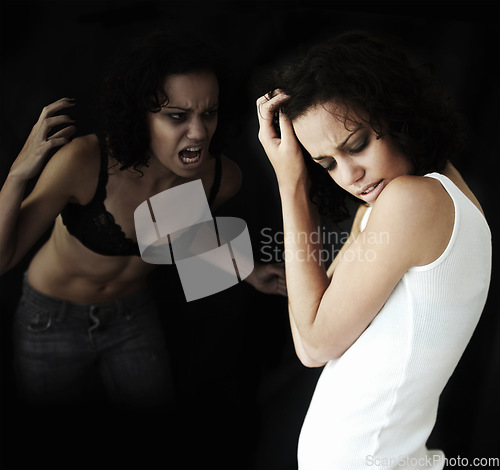 Image of Anorexia, bipolar and woman with stress, identity crisis and depression against a dark studio background. Female person, model and girl with mental health issue, problem and anxiety with trauma