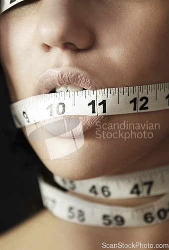 Image of Anorexia, measuring tape and suffering with mouth of woman for eating disorder, weight loss and fear. Diet, frustrated and mental health with closeup of female for anxiety, stress and bulimia problem