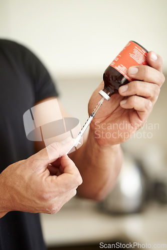 Image of Man, filling a syringe or liquid injection of testosterone and bottle, steroids and closeup of bodybuilder hands. Athlete, fitness performance on hormone supplement and medicine vial with needle