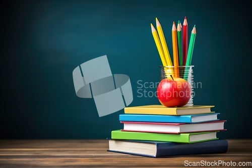 Image of Stack of books with pencils