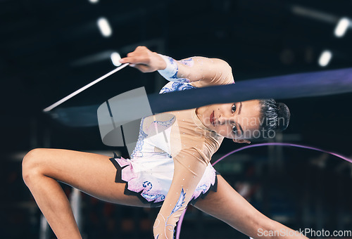 Image of Ribbon gymnastics, woman and portrait in performance, dance training and sports competition. Female, rhythmic movement and flexible dancing athlete, balance action or creative talent in concert event