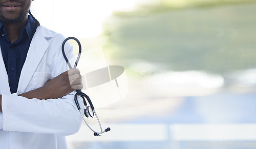 Image of Doctor, man and hands with stethoscope for healthcare insurance, cardiology or checkup against a blurred background. Hand of male medical professional arms crossed in confidence for health at clinic