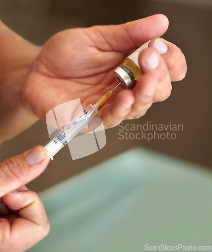 Image of Filling a syringe, hands and clear liquid injection of testosterone and bottle, steroids and closeup of bodybuilder. Male athlete, grow strong muscles on hormone supplement and vial with needle