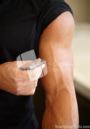 Image of Hormone injection, steroids and an arm with medicine for health, training and energy for exercise. Strong, testosterone and a male bodybuilder injecting a supplement for fitness goals and muscle