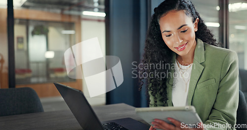 Image of Office laptop, tablet and happy woman reading financial portfolio, stock market review or investment feedback. Forex economy, trading or African trader smile for NFT, bitcoin or crypto revenue report