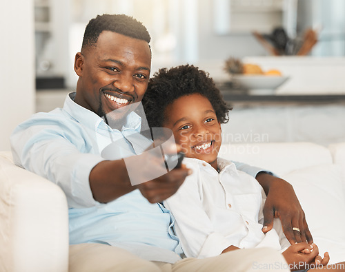 Image of Black family, sofa and father with boy with tv remote for channel, streaming movies and watching film. Love, home and happy dad with child with television control for entertainment, cartoon and relax