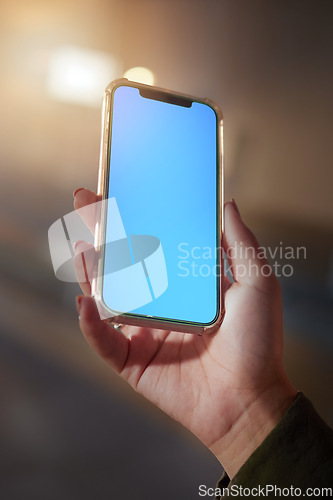 Image of Closeup, hands or smartphone green screen for woman on social media app, night research or internet mockup branding. Blue, mock up or technology for working late person on business product placement