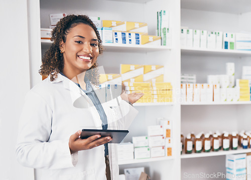Image of Digital tablet, portrait and woman pharmacist in a medication dispensary at the medicare clinic. Happy, smile and female pharmaceutical healthcare worker with a mobile device by medicine in pharmacy.