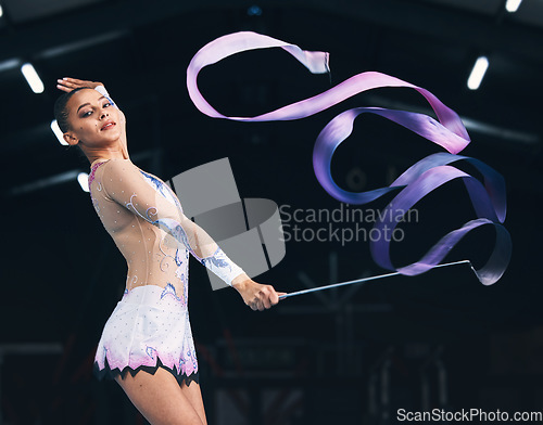 Image of Portrait ribbon and woman gymnast with fitness, performance art and training. Gymnastics, dancing and studio show of a gymnastic dancer in a exercise competition with creative workout and moving