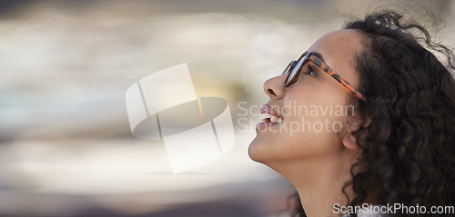 Image of Freedom, travel and happy woman outdoors for holiday, vacation and excited on blurred background. Journey, smile and young girl having fun, enjoying and exploring city or downtown, carefree and joy