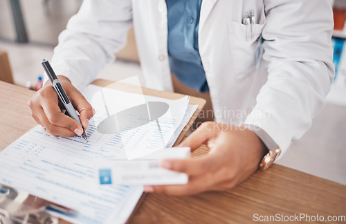 Image of Hands, pharmacist or person writing medicine pills or supplements products to write drugs inventory. Paperwork, healthcare clinic or doctor with box of medical product or pharmacy stock checklist