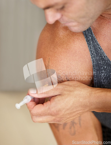 Image of Sports, steroids and male body builder with a syringe in his arm for muscle development. Fitness, testosterone supplement and man athlete injecting with a hormone liquid drugs with needle for biceps.