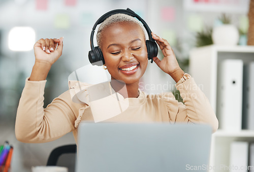 Image of Dance, happy and black woman with music in office, radio break and listening to audio. Smile, enjoying and dancing African employee with headphones for streaming a podcast, songs and playlist