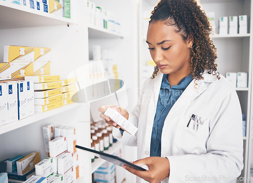 Image of Tablet, stock and healthcare with a woman in a pharmacy to fill an online order of prescription treatment. Medical, product and insurance with a female pharmacist working as a medicine professional