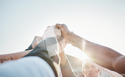 Image of Hands up, motivation or sports men in huddle with support, hope or faith on baseball field in game together. Teamwork, fist or group of young softball athletes with goals, mission or solidarity