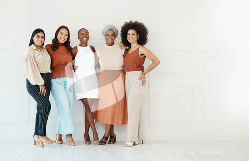 Image of Portrait, teamwork and business women smile in office standing together by white wall mockup. Happiness, diversity and group of friends, employees or staff with cooperation or workplace collaboration