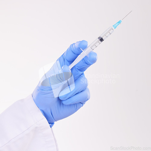 Image of Healthcare, hand and doctor with vaccine, injection or shot in studio against a white background. Medicine, vaccination and man health expert with needle for medical, innovation or disease treatment