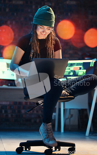 Image of Laptop, woman and hacker typing in home for programming, software or cybersecurity. Smile, computer and happy female coder or it programmer with ransomware for hacking while on dark web at night.