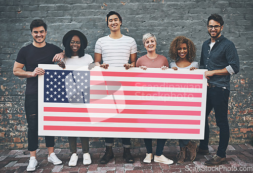 Image of Happy, diversity and people with a USA flag for representation, support and branding. Smile, together and group of people with a poster to represent a country, show patriarchy and diverse environment