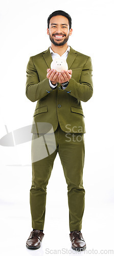 Image of Smile, piggy bank and portrait of businessman in studio with happy financial freedom and security savings. Happiness, Indian man with money box and saving by investing in small business startup plan.