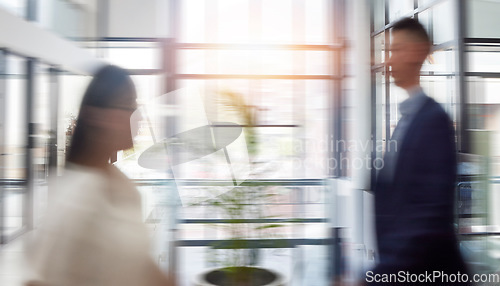 Image of Motion blur, business and people in office, moving and fast speed with deadline, schedule and consultants. Employees, coworkers and agents in workplace, busy and walking for new project and agency