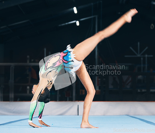 Image of Woman, gymnastics and handstand for flexible performance, body stretching and dance in sports arena. Female, rhythmic movement and balance upside down in talent show, competition or agility challenge