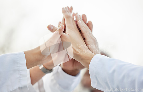 Image of Hands, doctors and group high five in closeup for motivation, success or team building in hospital. Doctor, teamwork and hand gesture for solidarity, support or collaboration for healthcare in clinic