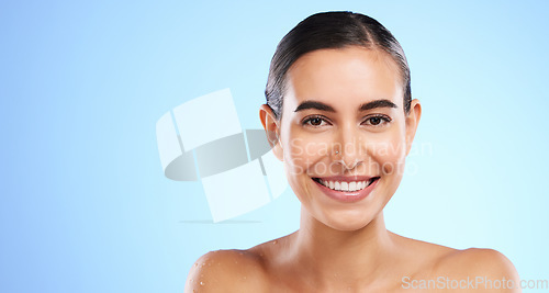 Image of Banner, skincare portrait or happy woman in studio with youth, beauty or young face on blue background. Dermatology mockup space, wellness or beautiful girl with facial treatments or glowing results