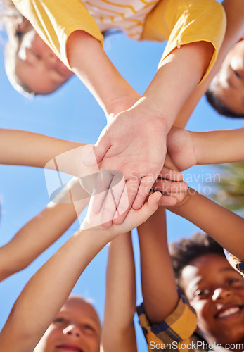 Image of Below hands stack, children together and outdoor for sunshine, teamwork and learning in summer. Happy kids group, low angle and support with solidarity, diversity and playful in nature for excursion