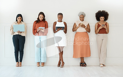 Image of Business women, networking and communication in waiting room for social media, career opportunity or job search. Group of woman employees on multimedia devices for mobile app or network in a row