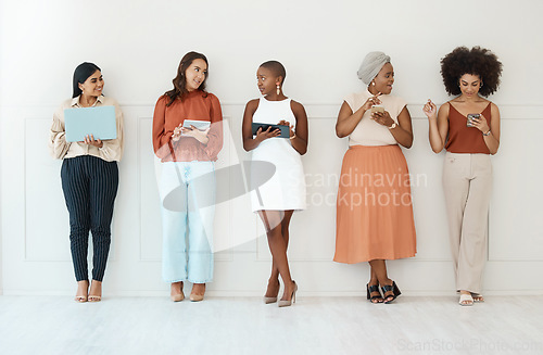 Image of Businesswomen, networking and communication in waiting room for social media, career opportunity or job search. Group of woman employees in multimedia collaboration, mobile app or network in a row