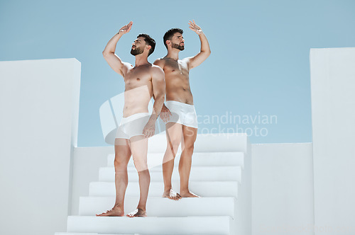 Image of Cover, creative and men on building stairs and looking for shade in an open space. Macho, together and couple or friends on steps covering from sun on a construction site for creativity and posing