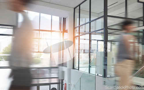 Image of Busy office, business people and walking with motion blur or fast speed in company. Employees, coworking and workers rush with movement in workplace, lobby or hallway for workspace productivity.