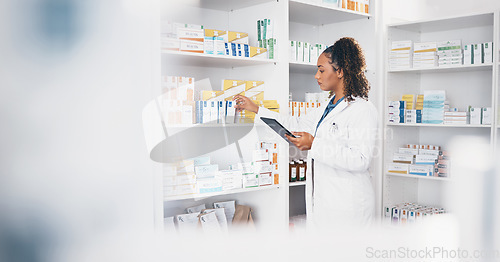 Image of Tablet, stock and medical with a woman in a pharmacy to fill an online order of prescription treatment. Healthcare, product and insurance with a female pharmacist working as a medicine professional