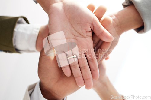 Image of Teamwork, closeup and hands stacked of support, target or team building mission in circle or group motivation below. Business people, together hand sign in community goals or professional cooperation