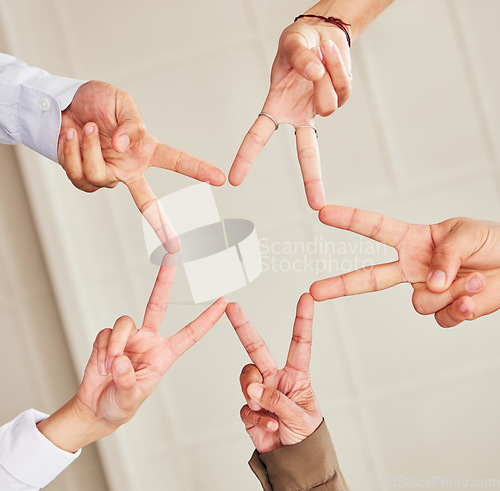 Image of Star, low angle or business people with peace sign, team work or community collaboration in office building. Partnership, closeup or hands of employees with support, solidarity or motivation together