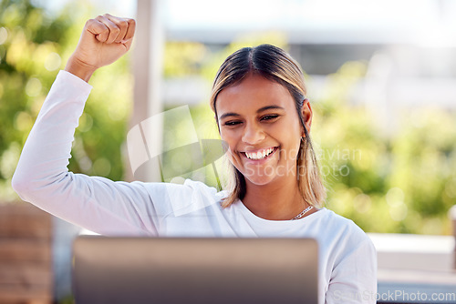 Image of Winner, laptop and celebration with a freelance work remote working from home on her small business startup. Wow, motivation and cheering with an attractive young female entrepreneur working online