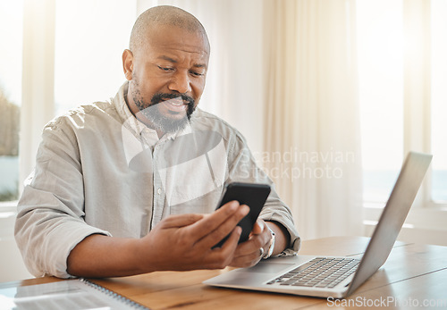 Image of Phone, laptop and remote work with a black man checking his debt or banking from the home office. Pension, contact and communication with senior male working on finance in a living room of his house