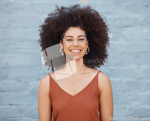 Image of Portrait, happy woman and smile on brick wall background with happiness and joy. Face, confident and beauty of young, excited and mixed race person, girl or female from South Africa standing alone.