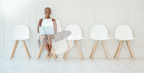 Image of Portrait, laptop and black woman in waiting room, interview or recruitment, hiring or office job. Computer, hr and happiness of business person or African female sitting on chair for employment.