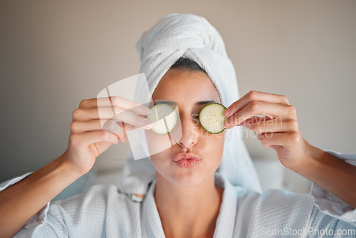 Image of Self care, skincare and woman with cucumber on her face for a organic, cosmetic and natural skin routine. Beauty, vegetable and female doing a spa facial treatment for self love and to relax at home.