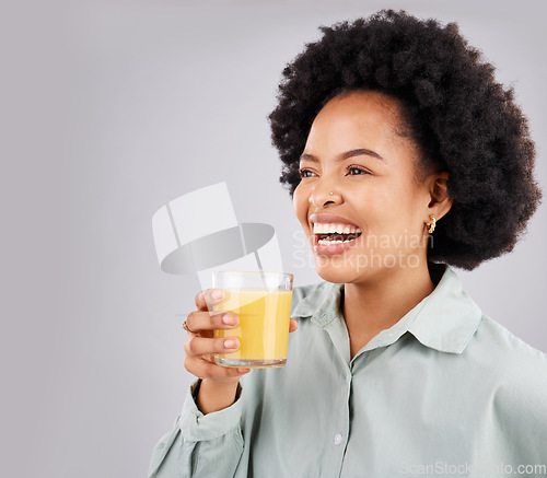 Image of Thinking, mockup and orange juice with a laughing woman in studio on a gray background for health or vitamin c. Idea, drink and glass with a happy young female drinking a fresh beverage for nutrition