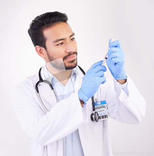 Image of Healthcare, vaccine and man doctor with injection or shot in studio against a white background. Medicine, vaccination and man health expert with needle for medical, innovation or disease treatment