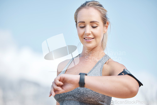 Image of Fitness, woman and smart watch checking time, tracking performance or monitoring exercise in nature. Happy and fit female runner looking at wristwatch for sport tracker, counter or workout on mockup