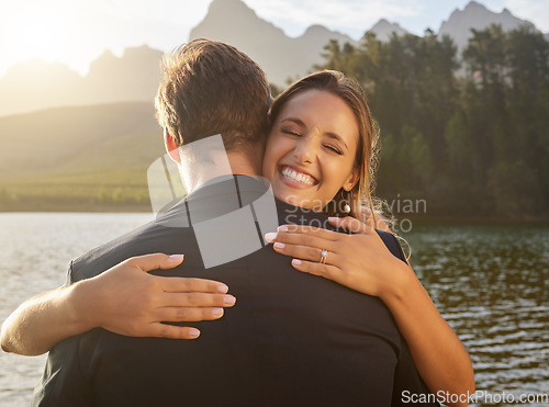 Image of Wedding, lake and happy couple hugging in nature and water with passion, smile and romance. Marriage, excited bride and groom hug to celebrate romantic relationship, loving man and woman together.