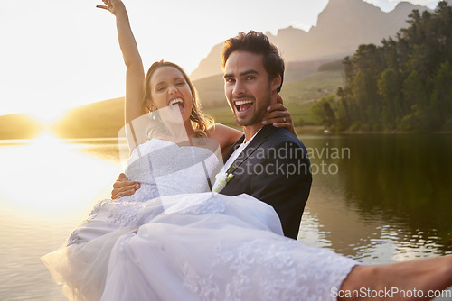 Image of Wedding, lake and groom carrying bride in nature and water with passion, smile and romance. Marriage, excited happy couple celebrate love and romantic relationship, loving man and woman together.