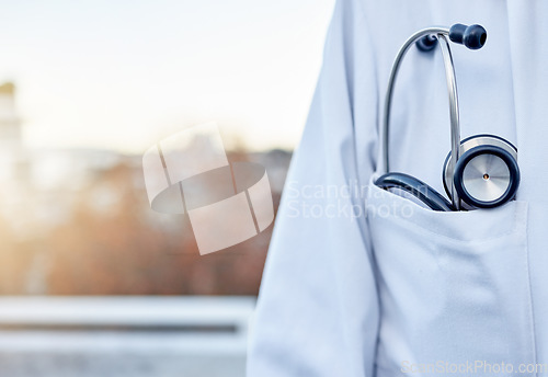 Image of Doctor, stethoscope and pocket in city for healthcare cardiology on balcony rooftop for surgery on mockup. Closeup of medical professional or expert with listening device for sounds in an urban town